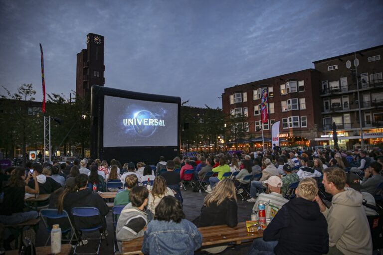 People enjoying an open-air film at the Open Air Film Festival.